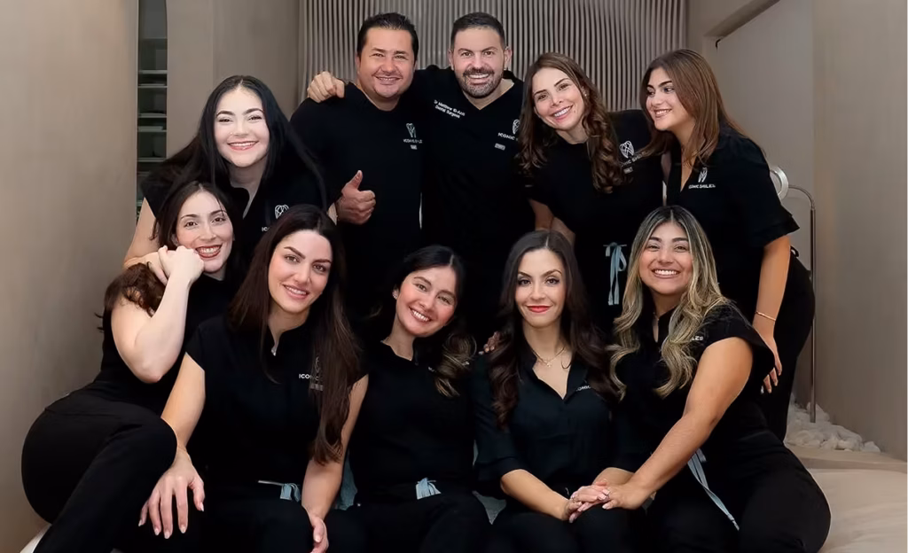 The Iconic Smiles dental team of dentists and clinicians smiling together in the Roselands clinic in Sydney